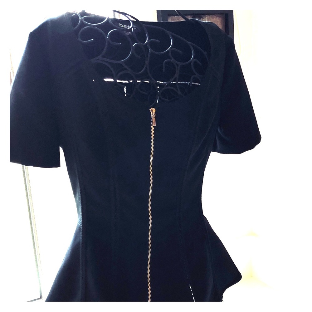 BEBE short sleeved peplum style top